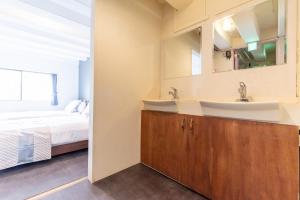 Postel nebo postele na pokoji v ubytování LUANAHOTEL IN NAKANO