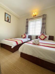 Postel nebo postele na pokoji v ubytování Dylan Hotel