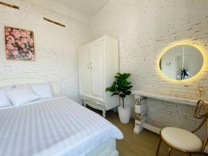 Postel nebo postele na pokoji v ubytování Dylan Hotel
