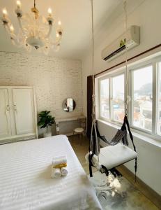 Postel nebo postele na pokoji v ubytování Dylan Hotel