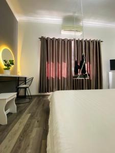Postel nebo postele na pokoji v ubytování Dylan Hotel