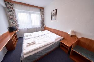 Letto o letti in una camera di Hotel Astra