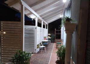 a white pergola on a patio at night at B&B La Casa Di Giò in Lanciano