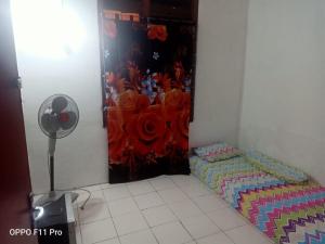 Lova arba lovos apgyvendinimo įstaigoje Tambak Bayan Guesthouse