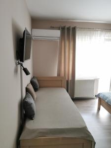 Postel nebo postele na pokoji v ubytování Apartmani Milica