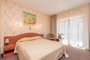 Ένα ή περισσότερα κρεβάτια σε δωμάτιο στο Vila Vitalija