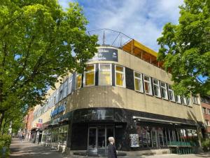 a man is walking in front of a building at instantSleep Backpackerhostel St Pauli in Hamburg