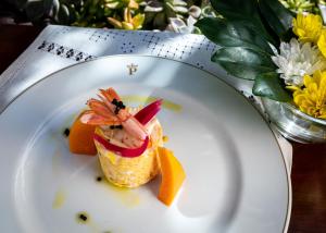 a white plate with a dessert on a table at Parador de La Gomera in San Sebastián de la Gomera
