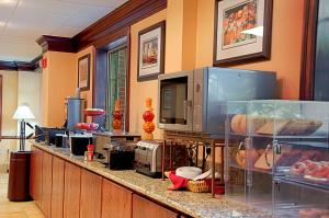 a kitchen with a counter with some food on it at Best Western Mason Inn in Mason