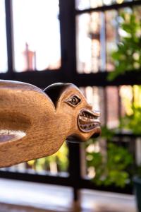 a wooden animal sticking its head out of a window at Parador de La Gomera in San Sebastián de la Gomera