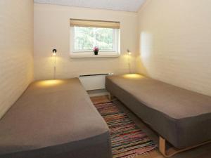 Postel nebo postele na pokoji v ubytování Holiday home Hadsund LXVII