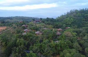 an aerial view of a village on a hill at Heritage Resort Coorg in Madikeri