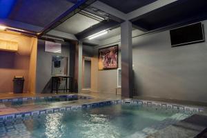 a large pool of water in a room at De'Tonga Hotel in Medan