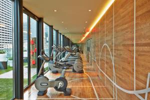 a row of exercise bikes in a gym at citizenM New York Times Square in New York +36 photos