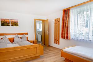 Кровать или кровати в номере Brandnerhof