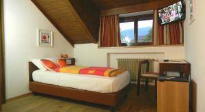 Postel nebo postele na pokoji v ubytování Hotel Bologna