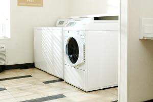 a white washer and dryer in a room at Candlewood Suites Boise - Towne Square, an IHG Hotel in Boise
