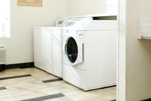 a white washer and dryer in a room at Candlewood Suites Boise - Towne Square by IHG in Boise