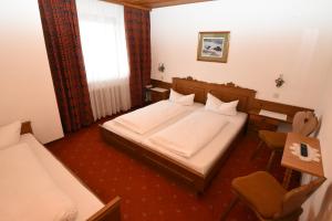 Posteľ alebo postele v izbe v ubytovaní Hotel Klausen