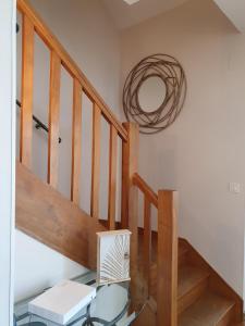 a room with a glass table and a wooden staircase at LA MAISON DU MUGUET - Accueil Chevaux - Horse Friendly in Liart