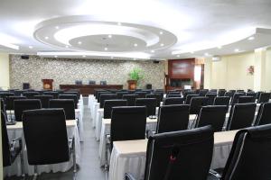 a large room with rows of tables and chairs at Malaika Beach Resort in Mwanza