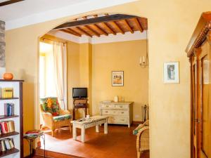 a living room with a couch and a table at Il Castello Gavorrano in Gavorrano