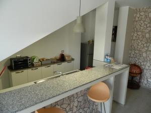 Virtuvė arba virtuvėlė apgyvendinimo įstaigoje A Casa di Anna - Locazione Turistica -