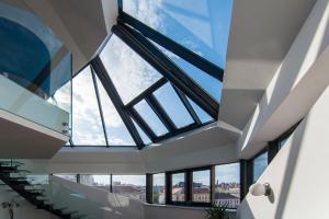 a large skylight in the ceiling of a building at easy flat Margareten Apartments in Vienna