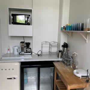 Kuchyň nebo kuchyňský kout v ubytování Hedmansgården