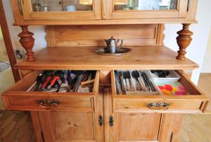 a wooden cabinet with a sink in it at Gästehaus La Madonnina in Bad Breisig