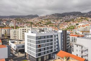 an aerial view of a city with buildings at Santa Luzia I by An Island Apart in Funchal