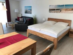 Postel nebo postele na pokoji v ubytování Steiner Strandappartements Appartement 101 Seeseite