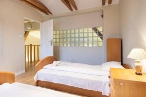 Posteľ alebo postele v izbe v ubytovaní FLORIANSKA Penthouse DeLux