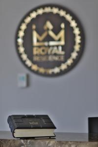 Certifikat, nagrada, znak ali drug dokument, ki je prikazan v nastanitvi Royal Residence