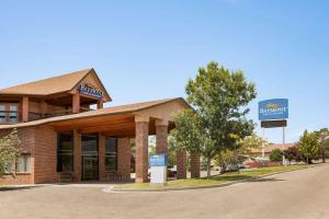 a building with a sign in front of it at Baymont by Wyndham Cortez in Cortez