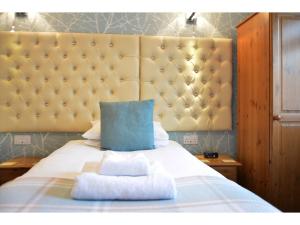 Ένα ή περισσότερα κρεβάτια σε δωμάτιο στο Ashlea Guest House