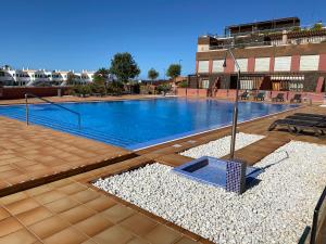 a large swimming pool in a building at Marfolín 28 in Cotillo