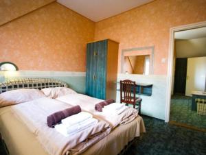 Posteľ alebo postele v izbe v ubytovaní Piknik Wellness Hotel