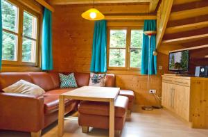 Televízia a/alebo spoločenská miestnosť v ubytovaní Appartement Ramsau, Haus Fichte