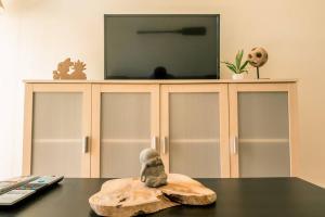 A television and/or entertainment centre at TGH/ Malagueta paradise II