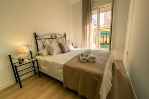 A bed or beds in a room at TGH/ Malagueta paradise II