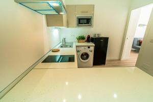 A kitchen or kitchenette at TGH/ Malagueta paradise II