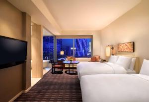 Televiisor ja/või meelelahutuskeskus majutusasutuses Grand Hyatt Macau