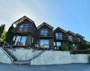 a house with four windows on top of some stairs at Million dollar view in Queenstown