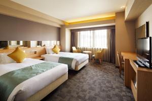 Almont Hotel Kyoto tesisinde bir odada yatak veya yataklar
