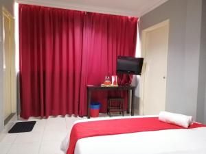 Postel nebo postele na pokoji v ubytování Puteri Ampang Hotel