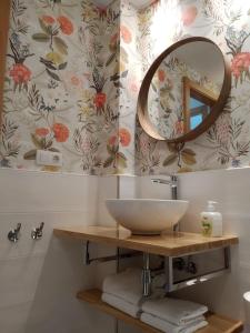 a bathroom with a sink and a mirror at Mirador de Alcañiz in Alcañiz