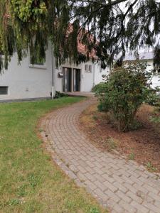a brick path in front of a house at FEWO-ATLANTA Reinhardshausen in Reinhardshausen