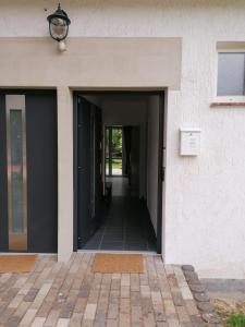 an open door of a building with a hallway at FEWO-ATLANTA Reinhardshausen in Reinhardshausen