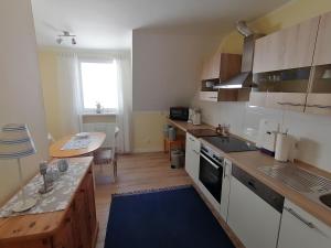 a kitchen with a sink and a counter top at Moni's Ferienwohnung in Bad Bertrich